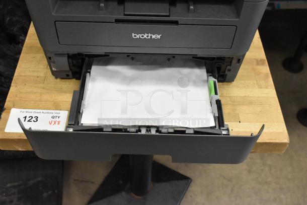 Brother MFC-L2710DW Copier Scanner Printer, gray, open paper tray, working condition, auction label visible.