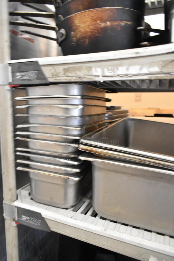 Alt text: Lot of stock pots and stainless steel bins on metal rack, various sizes. Used condition, MetroMax label visible.