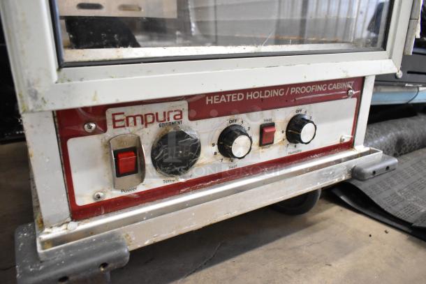 Empura E-HP1836 heated holding/proofing cabinet with controls, metal frame, on commercial casters, 120V, 1 Phase, visible wear.