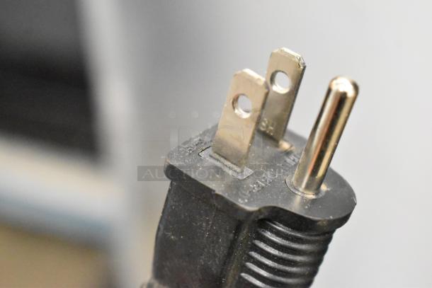 Close-up of a three-prong plug, part of the 2023 Empura E-HP1836 heated holding/proofing cabinet. 120 volts, 1 phase.