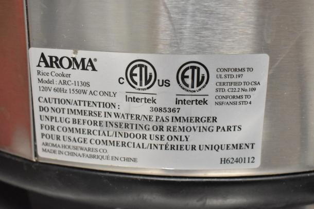 Aroma ARC-1130S rice cooker label showing model, 120V, 1550W, caution instructions, ETL certification, and made in China.
