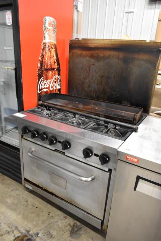 Mainstreet stainless steel commercial gas 6-burner range with oven, over shelf, and backsplash. Used condition.