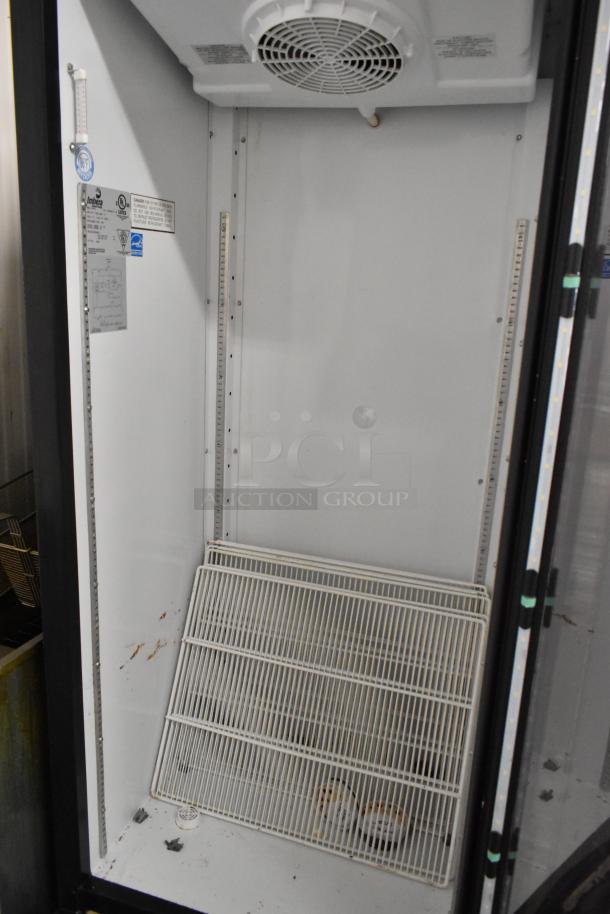 Imbera G319 commercial single door cooler with poly-coated racks, interior view. Labels show 115V, 1 phase. Signs of wear.
