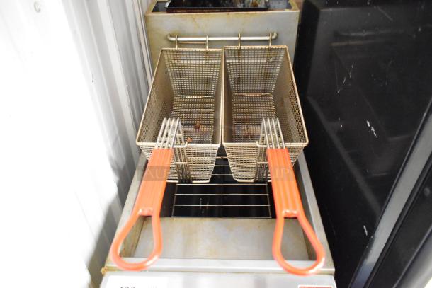 Motak MGF3-N-C stainless steel deep fat fryer with 2 metal fry baskets, natural gas powered, 90,000 BTU, shown in used condition.