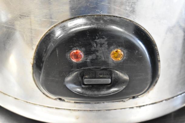 Amko AK-60ERC stainless steel countertop rice cooker, 120 volts, 1 phase, showing control panel with indicator lights.
