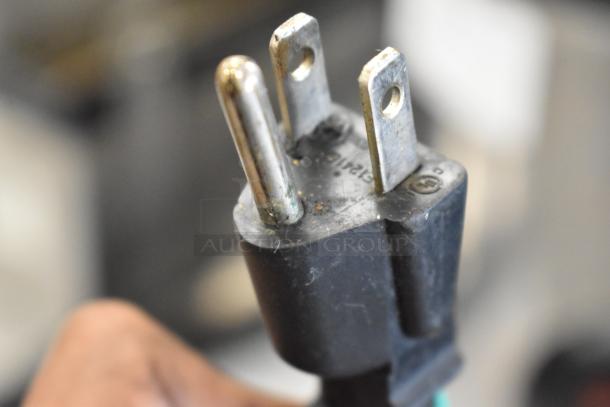 Close-up of a three-prong plug for Amko AK-60ERC Rice Cooker, showing slight wear. 120 Volts, 1 Phase compatible.