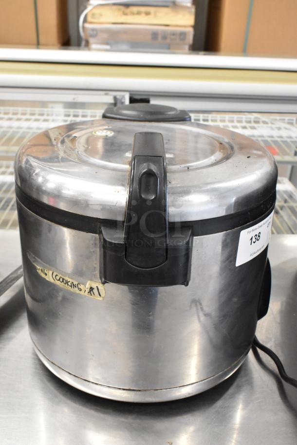 Amko AK-60ERC stainless steel countertop rice cooker, used condition, visible labels and markings, 120 volts, 1 phase.