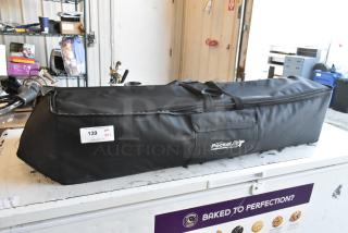 Black Cinevate Pocket Jib Pro in a carrying bag, visible logo, and auction tag with lot number 139.