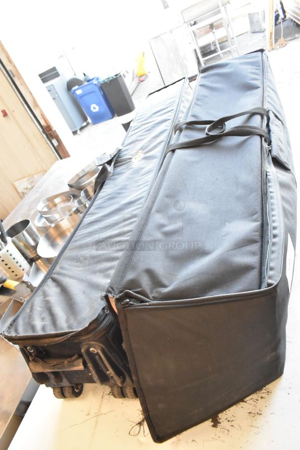 Black Cinevate 2 Pocket Jib Pro bags, used condition, with handles and zip closures. Ideal for professional filming gear.