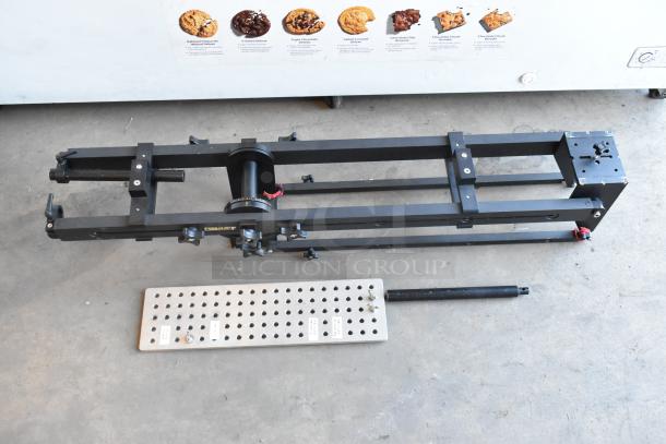 Cinevate 2 Pocket Jib Pro in black bags, metal frame, signs of use, with adjustable baseplate and mounting features.