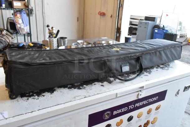 2 Pocket Jib Pro cine equipment in black bags, good condition. Bags feature sturdy handles and visible label.