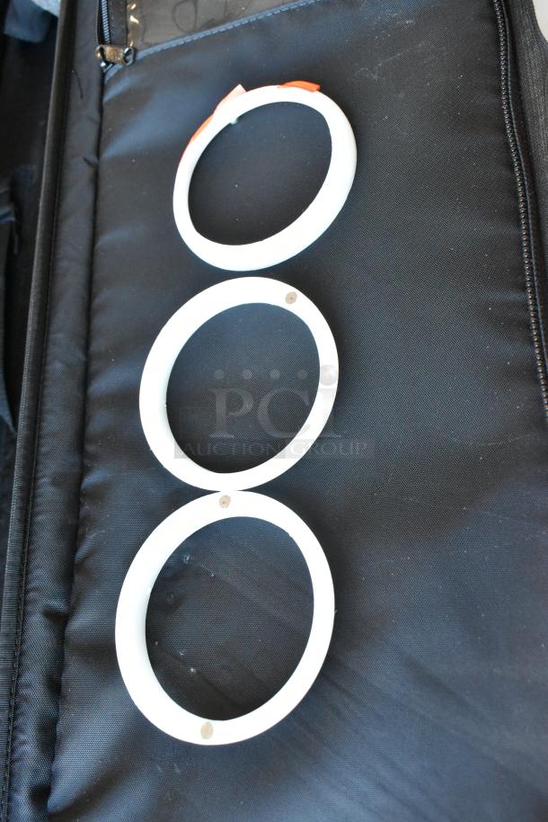 2 Pocket Jib Pro set in black bags, featuring three white circular components.