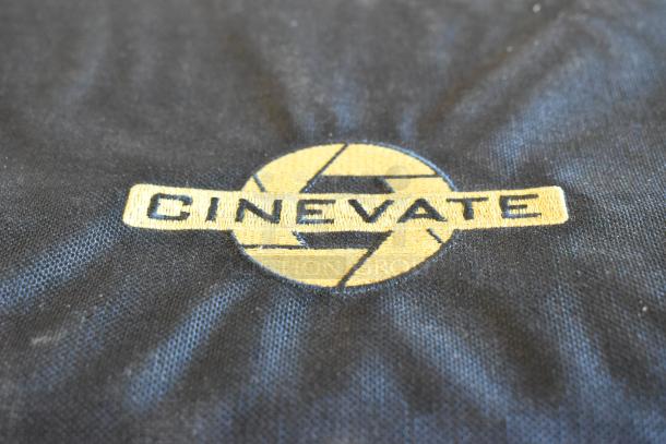 Four black bags with Cinevate logo, each containing undisclosed items. Fabric texture visible. Ideal for filmmakers.