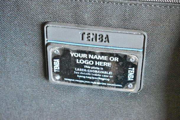 Tenba black bag with an engravable nameplate, textured fabric, and TENBA branding. Four bags included in the auction.