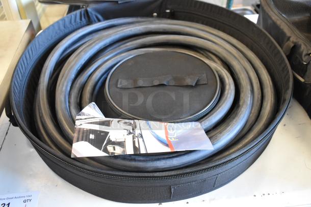 Four black bags with coiled hoses inside, featuring a zipper closure and a handle. Bags in good condition.