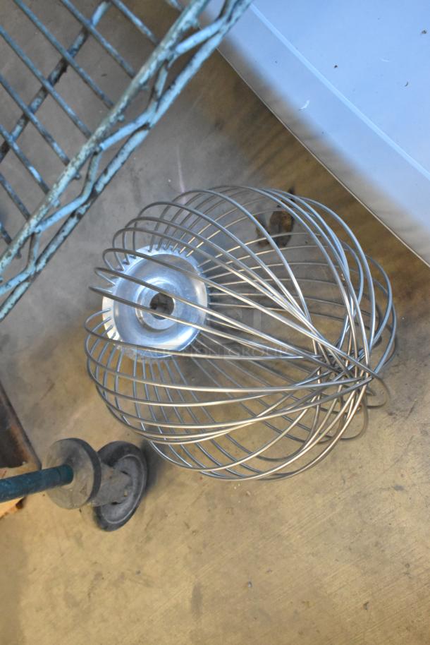 Metal commercial whisk attachment for Hobart mixer, in good used condition. Sturdy wires and metal base visible.