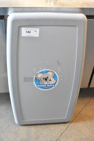 Koala Kare gray wall mount diaper changing station, clean condition, with logo and auction label visible.
