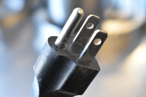 Plug of Ink Bird ISV-100W Sous Vide, 120 Volts, 1 Phase. Black, three-pronged design, in excellent condition.