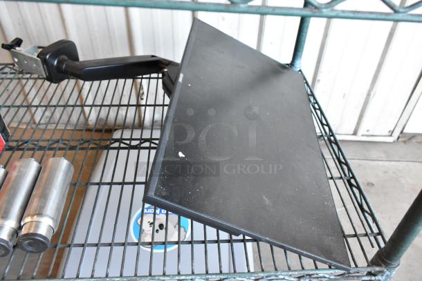Element EM2FPAB24B monitor with wall mount, black, minor surface marks, appears in fair condition.