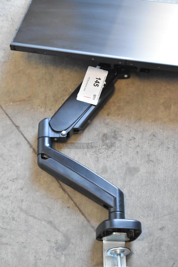 Element EM2FPAB24B monitor with wall mount. Features a sleek design with a secure mounting arm. Visible tag: Lot 145.