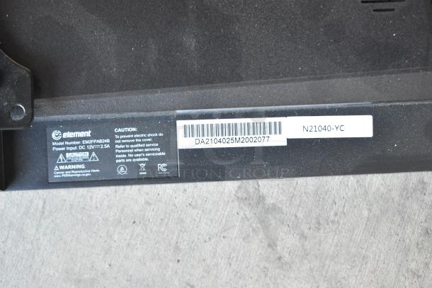 Element EM2FPAB24B monitor label shows model number, power input, and caution warnings. Includes wall mount.