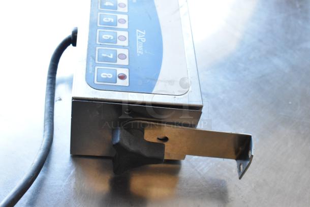 FMP Zap Timer, 115V, 1 Phase, showing numeric keypad and mounting bracket. In good condition, suitable for precise timing tasks.