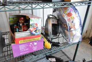 Lot of items including Mario Kart RC toy in box, heater with label "147", GiveBest PTC-905 salt gun, and Boppy pillow in floral bag.