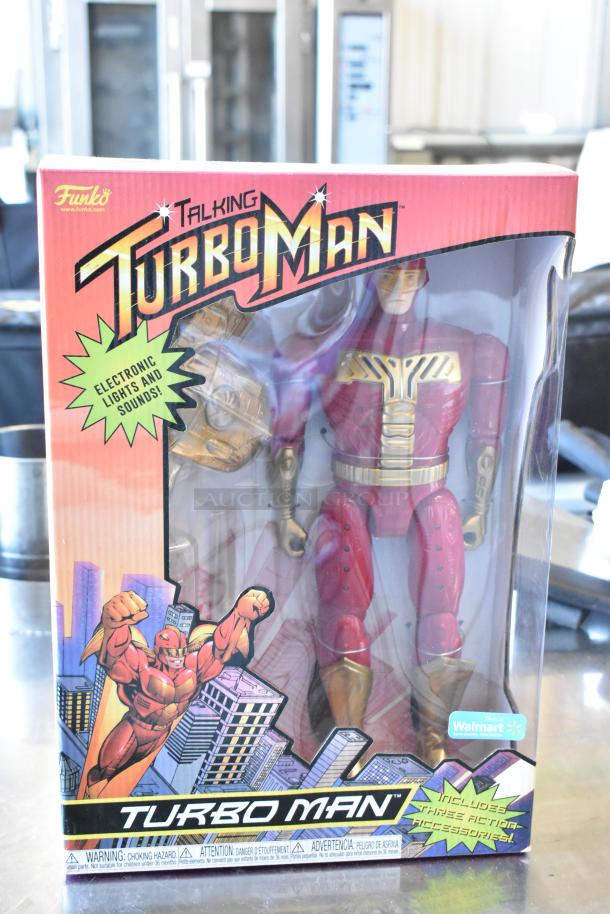 Funko Talking Turbo Man figurine in box, with electronic lights and sounds. Includes three action accessories.