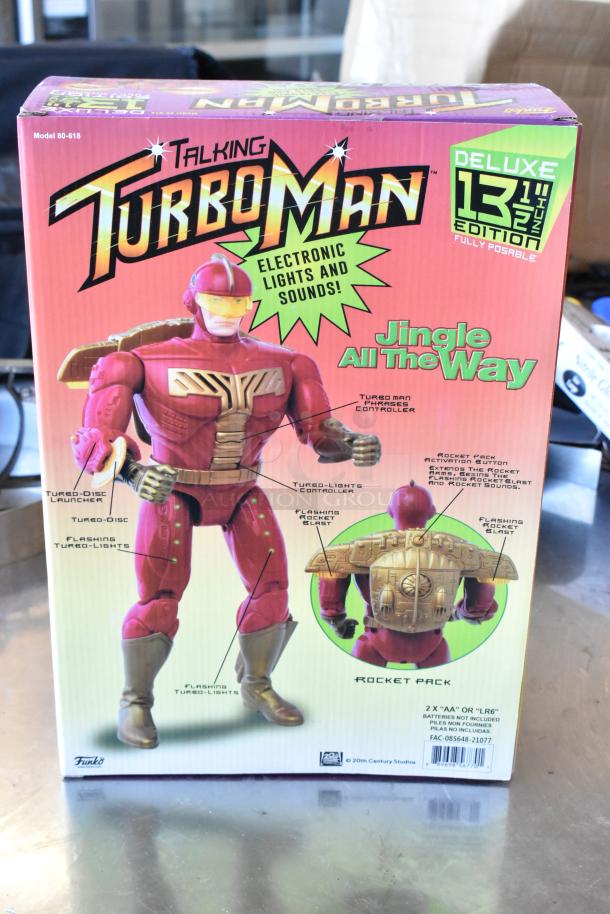 Turbo Man figurine in original packaging, featuring electronic lights and sounds. Deluxe 13.5" edition, model 80-618. Fully posable.