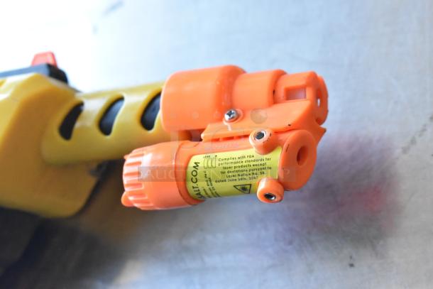 Orange tip of a GiveBest PTC-905 Salt Gun with label showing compliance information.