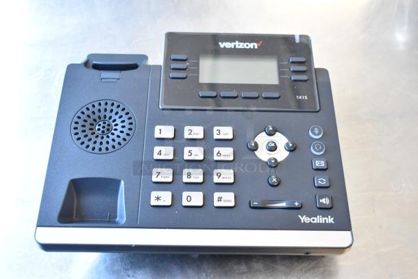 Verizon corded telephone, model T41S, features numeric keypad, speaker, and digital display. Good condition.