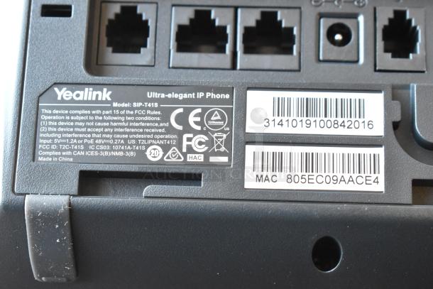 Barcode and label close-up on a Yealink SIP-T41S IP phone, showing compliance and FCC information.