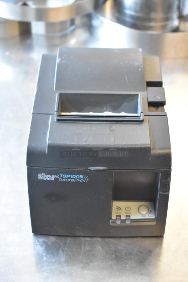 Star TSP100III receipt printer, used condition, black, with visible control buttons, ideal for retail environments.