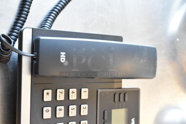 Verizon corded telephone with keypad and HD label. Part of auction lot including Star TSP100 printer and Cradlepoint AER2200.