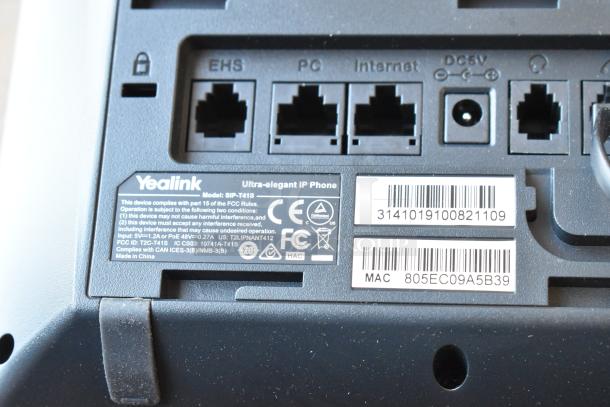 Yealink SIP-T41S IP Phone showing connections and labels. Model details and FCC compliance information visible.