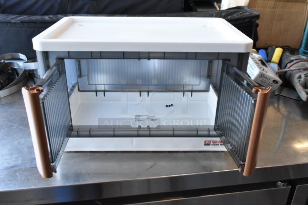 Lot of items including one open poly bin on a workbench, labeled "Haixin," with assorted tools and boxes nearby.
