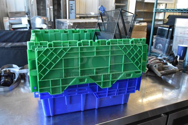 Lot of various items including three stacked poly bins, with contents. Green and blue bins on a metal surface.