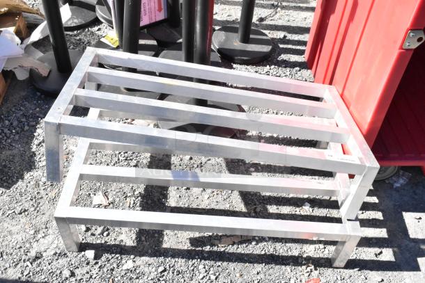 2 Regency 600DUN2036 metal dunnage racks, sturdy slatted design for heavy-duty storage, in good condition.