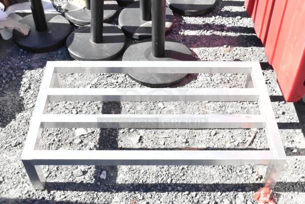 2 Regency 600DUN2036 metal dunnage racks, sturdy construction, excellent condition, ideal for restaurant storage needs.