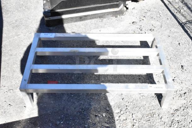 Regency 600DUN2036 metal dunnage rack, sturdy design, slight wear. Marked "Regency NSF." Ideal for storage.
