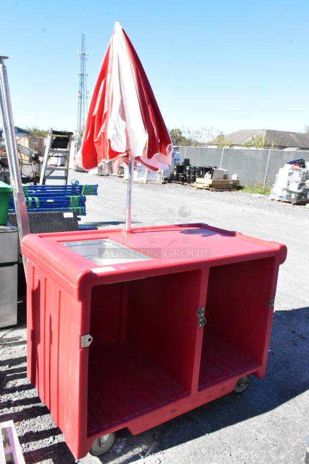 Cambro red poly portable work station with umbrella, stainless steel sink, on commercial casters. Good condition.
