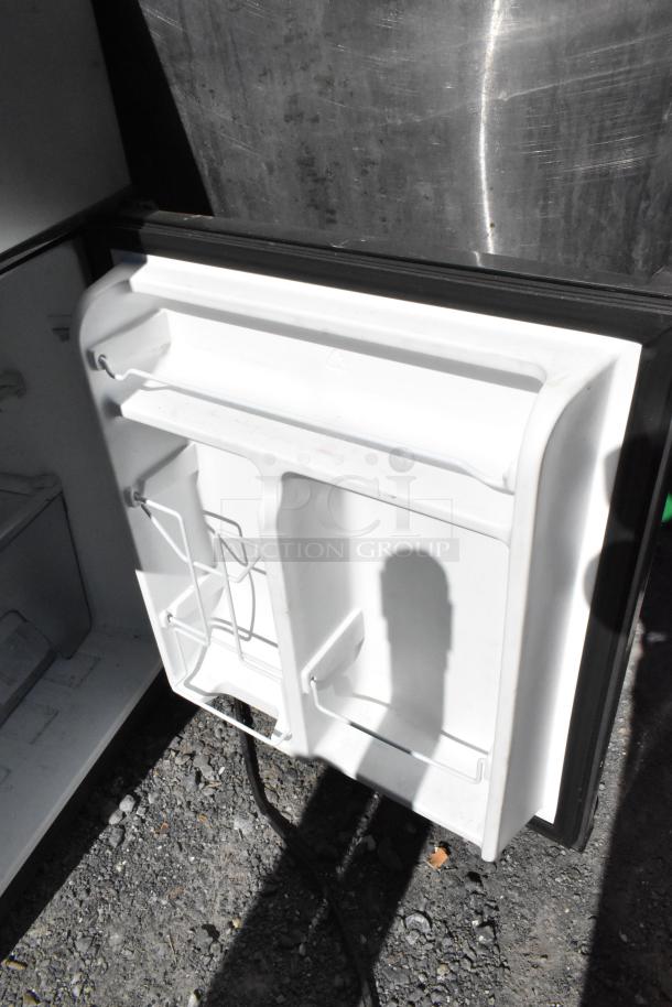 Galanz GLR31TS1E02 Mini Cooler with Freezer, 115V, 1 Phase. Features door shelves and interior compartment. Appears gently used.