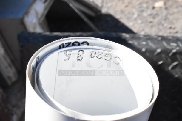 Box containing rolls of white material marked "C620 3.5," indicating size or type. Appears in good condition.