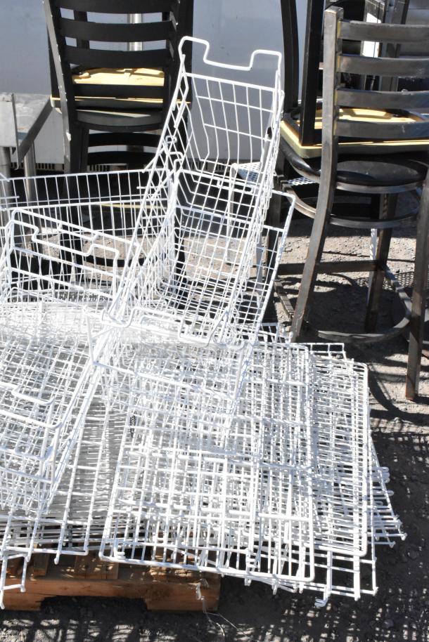 Pallet lot with several white poly freezer baskets in good condition, stacked on wooden pallet, suitable for storage.