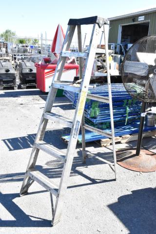 6' Louisville A-frame ladder in used condition, aluminum with visible labels and stable design, ideal for construction tasks.