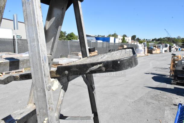 6' Louisville A-frame ladder, metal construction, used condition, sturdy platform, ideal for industrial use.