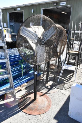 2 TPI FE-75S1fOL floor style metal fans, 115 volts, 1 phase, visible wear, metal construction, auction includes two fans.