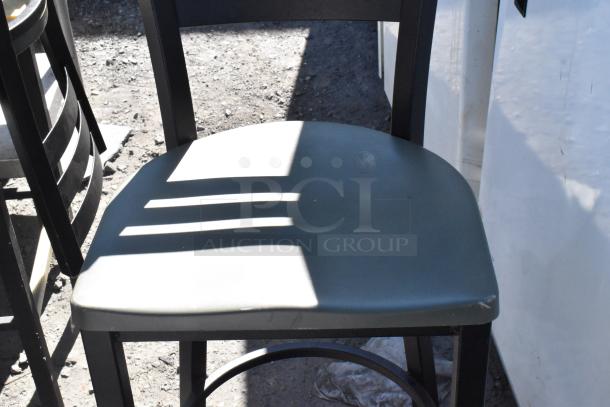 Black metal bar height chair with light wear on seat, part of a lot including 5 various chairs.