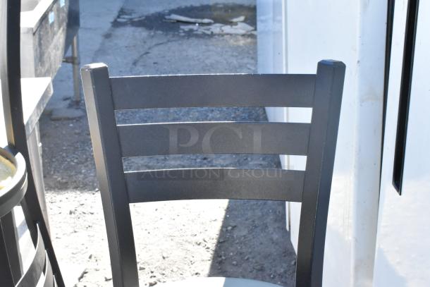 Set of 5 chairs including a black metal bar height chair. Features durable metal construction, modern design.