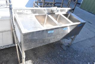 Regency 600B3101413LFT stainless steel 3 bay sink with left drain board, commercial use, features labeled wash, rinse, sanitize.